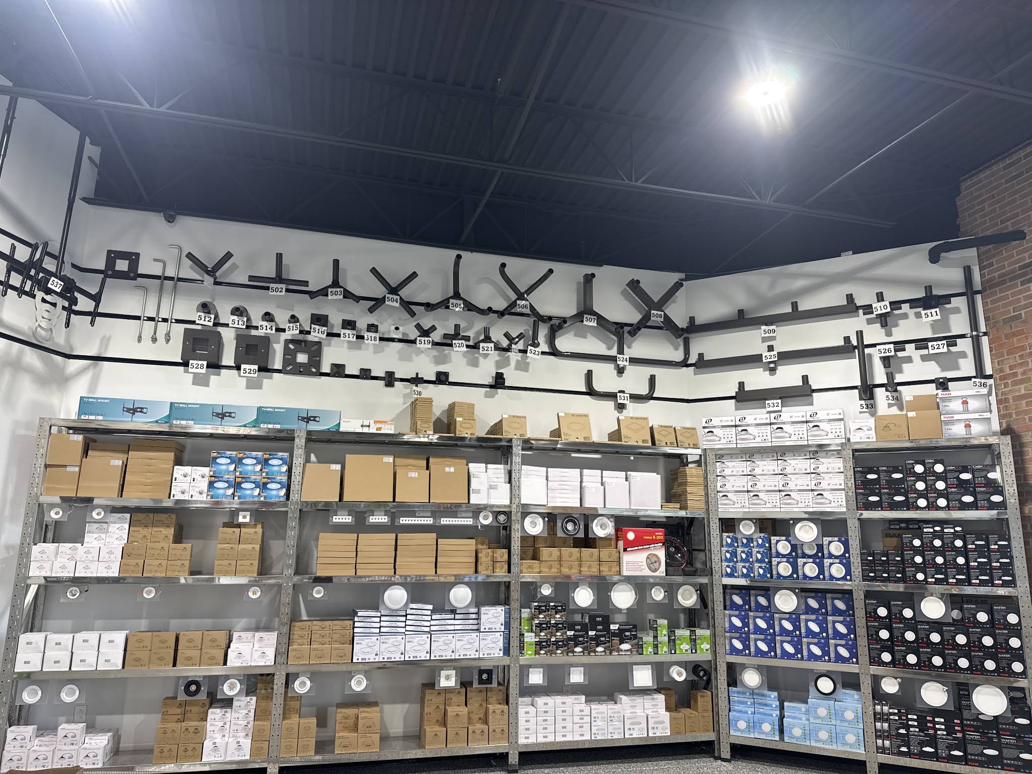 Lighting fixture displays and product shelving inside Excel’s Waterford branch